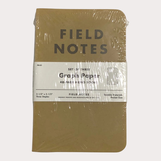 Packaged Field Notes graph paper notebooks on a white background