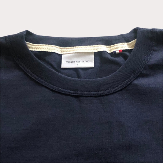 Navy blue shirt with a visible brand label on a white background