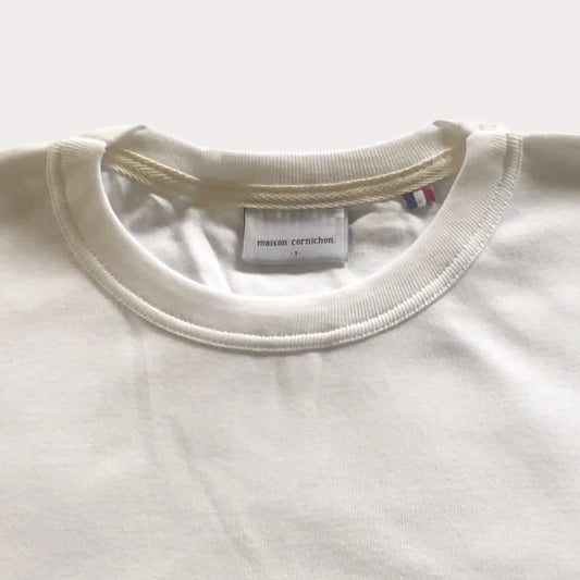 Close-up of a white sweatshirt with a brand label on a white background