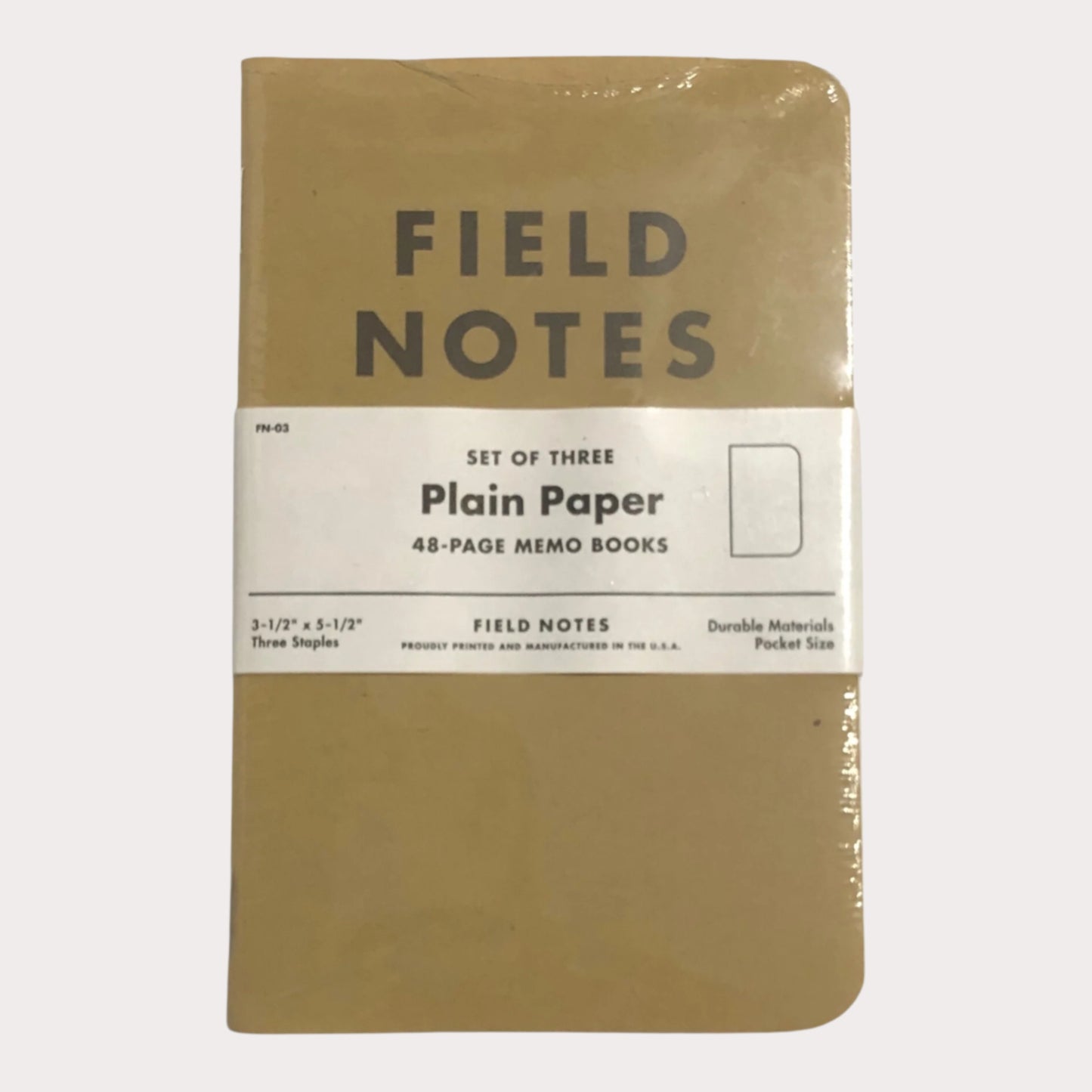 Set of three Field Notes notebooks with plain paper on a white background