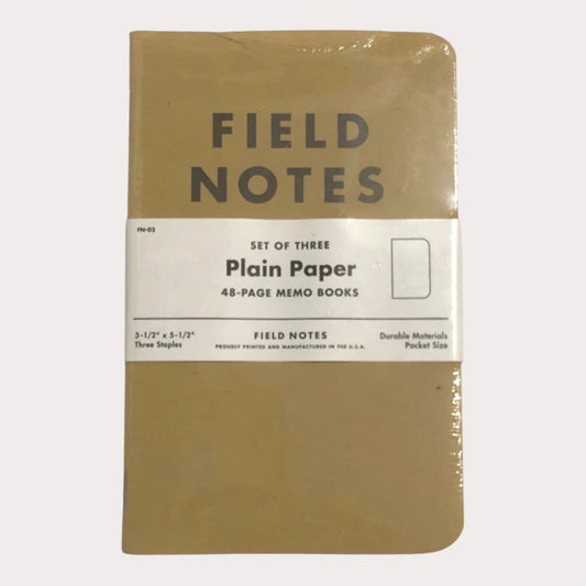 Set of three Field Notes notebooks with plain paper on a white background
