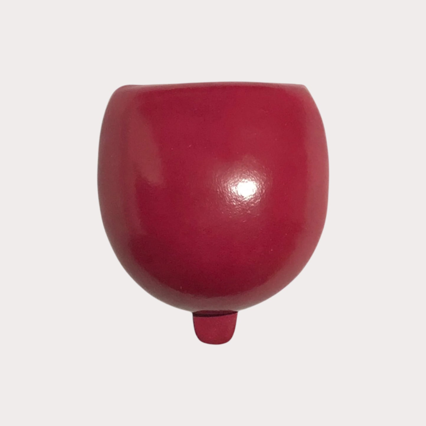 Red cup-shaped Il Bussetto Coin Poach on a white background